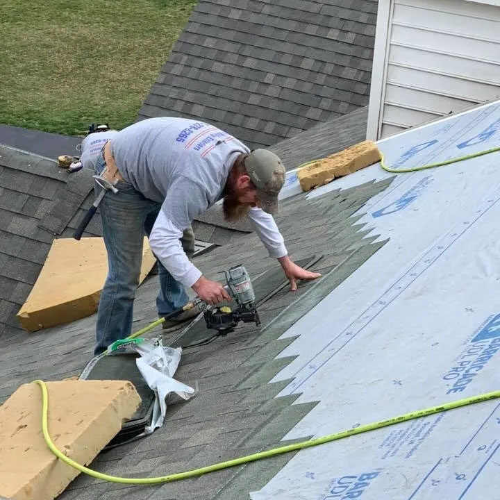Roofer installing a new roof.